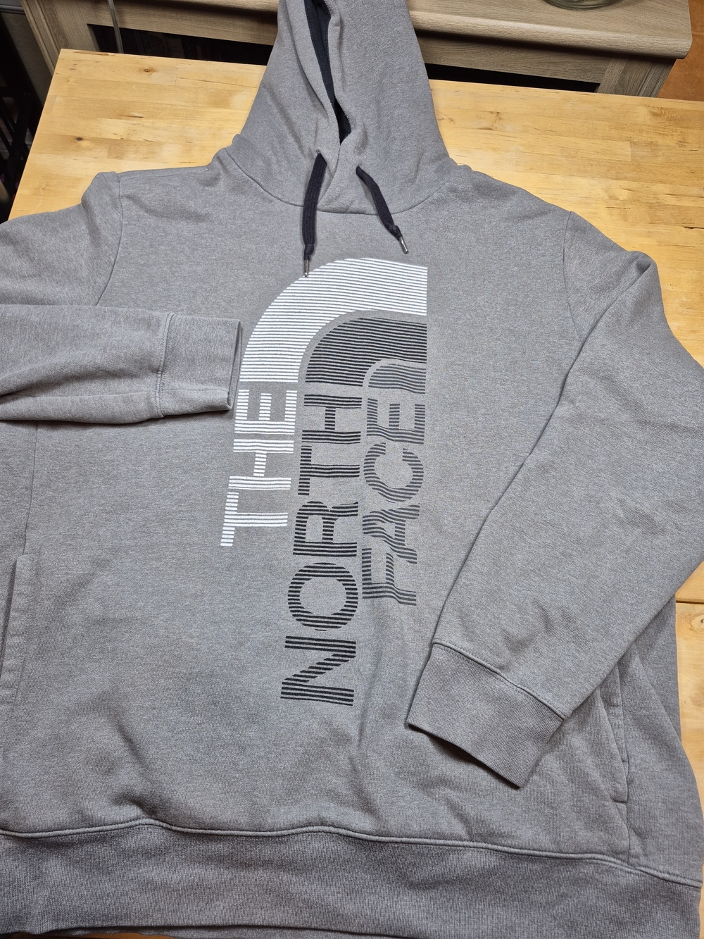 The North Face Grey Pullover Hoodie with Vertical Logo